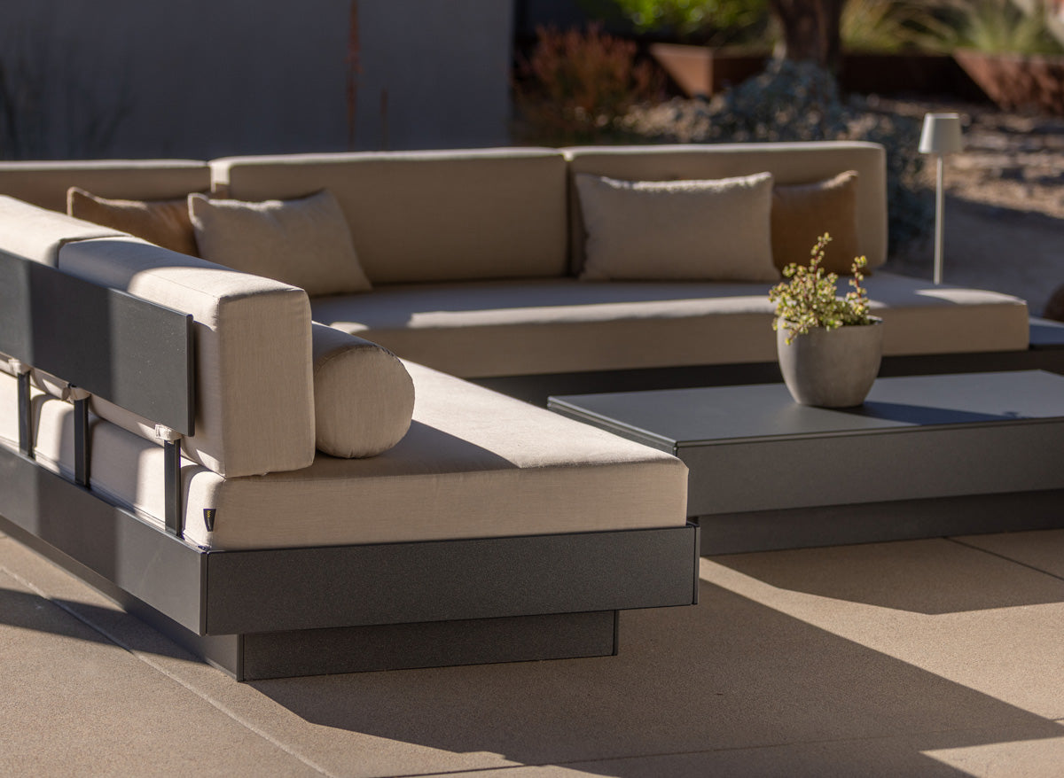 an image of a section "L" set up with two Charcoal Platform One Sofas with flax cushions in afternoon sunlight.