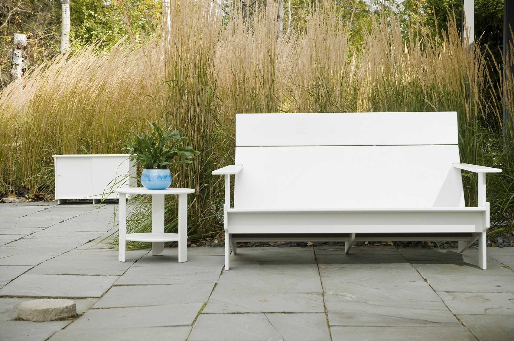 lollygagger sofa bench side table stone patio