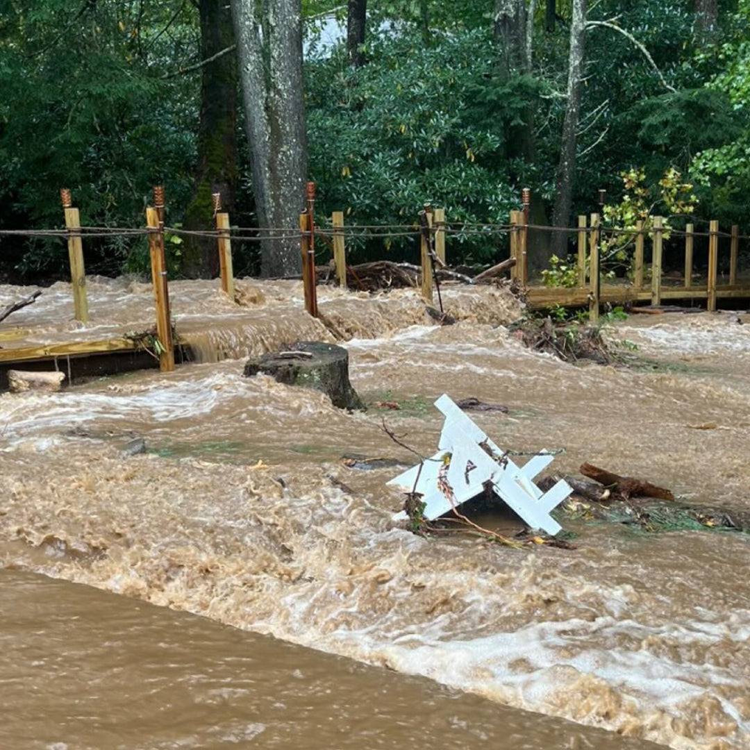 Image: A Cloud White Taavi Chair being swept away in high waters during Hurricane Helene.