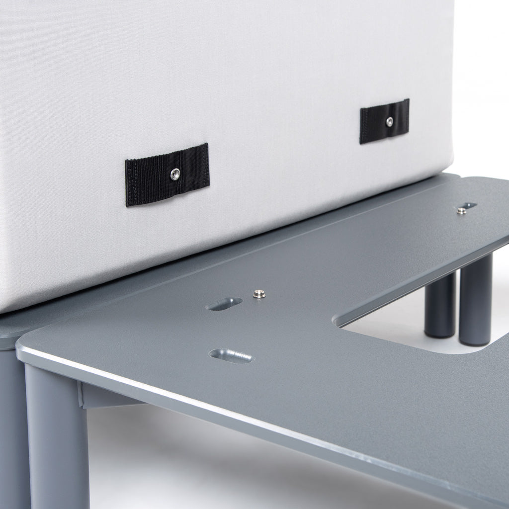 Close up image of the marine grade snaps on a cushion and the snaps on the base of the product. 