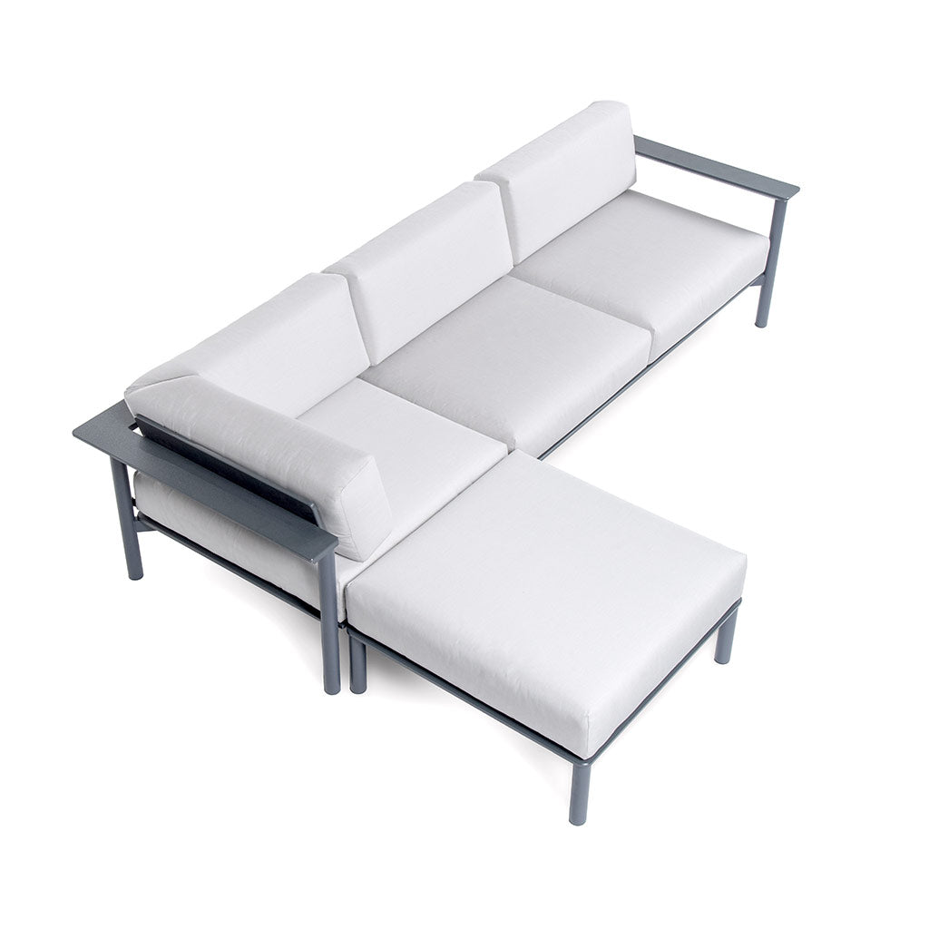 Aurora modular set up in an "L" with an ottoman, corner lounge, and left arm sofa with charcoal frame and cloud cushions