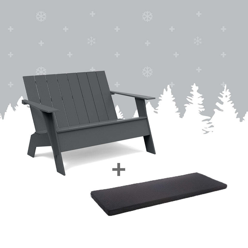 Tall Charcoal adirondack benchland a black bench cushion against grey forest background.