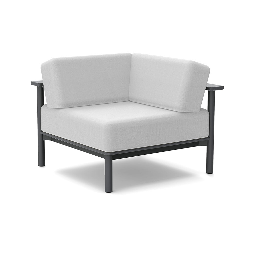 studio image of aurora corner lounge chair with grey frame and cloud cushions.