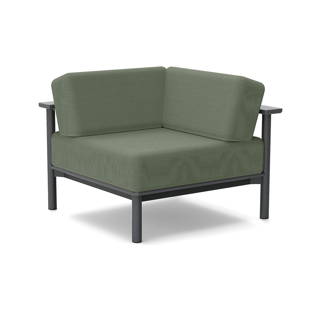 Studio image of a Corner Lounge Chair with Charcoal frame and Fern cushions.