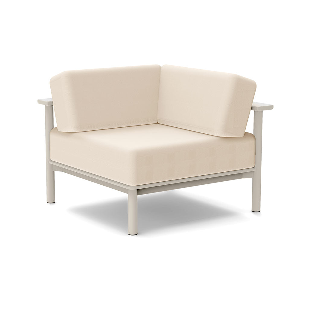 Studio image of a Corner Lounge Chair with Fog frame and Flax cushions.