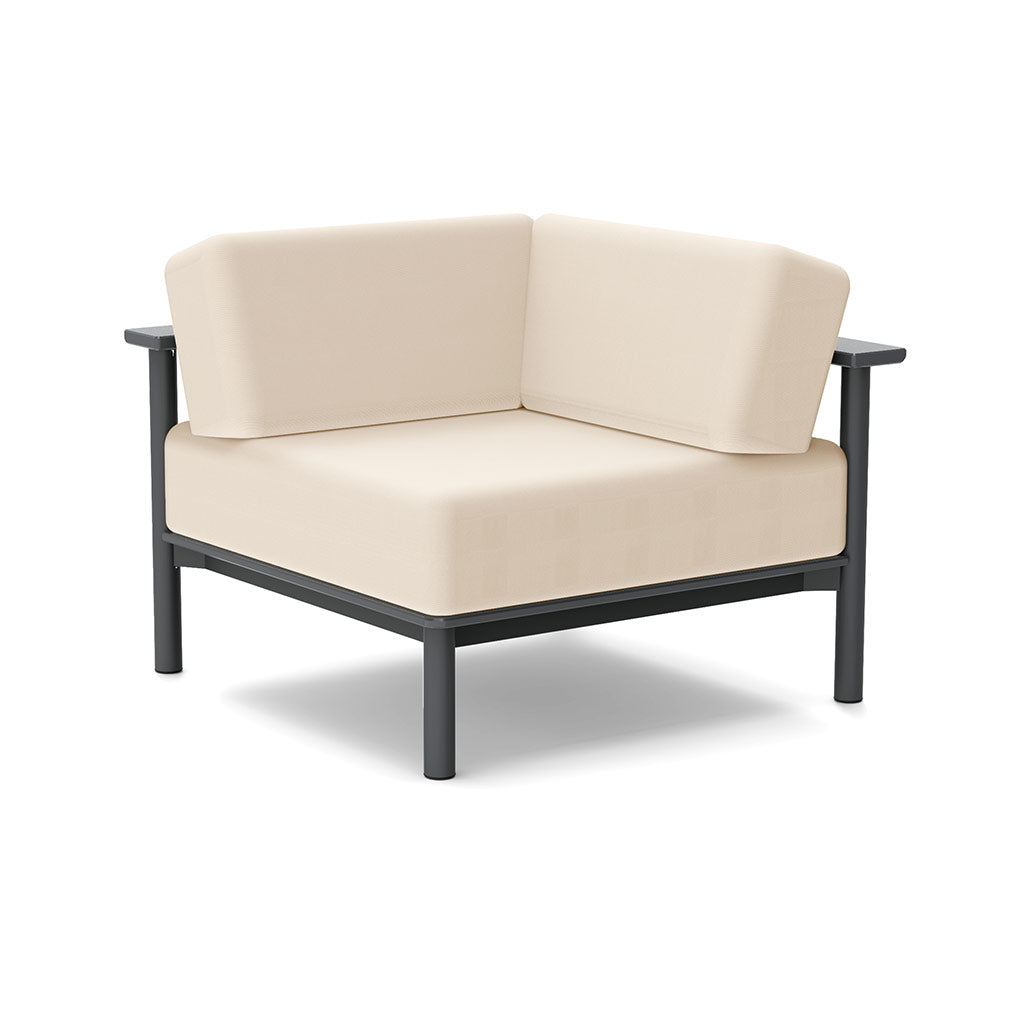 Studio image of a Corner Lounge Chair with Charcoal frame and Flax cushions.