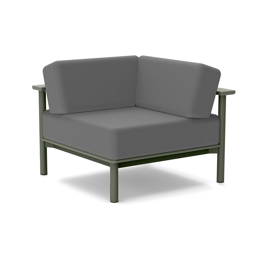 Studio image of a Corner Lounge Chair with Sage frame and Charcoal cushions.