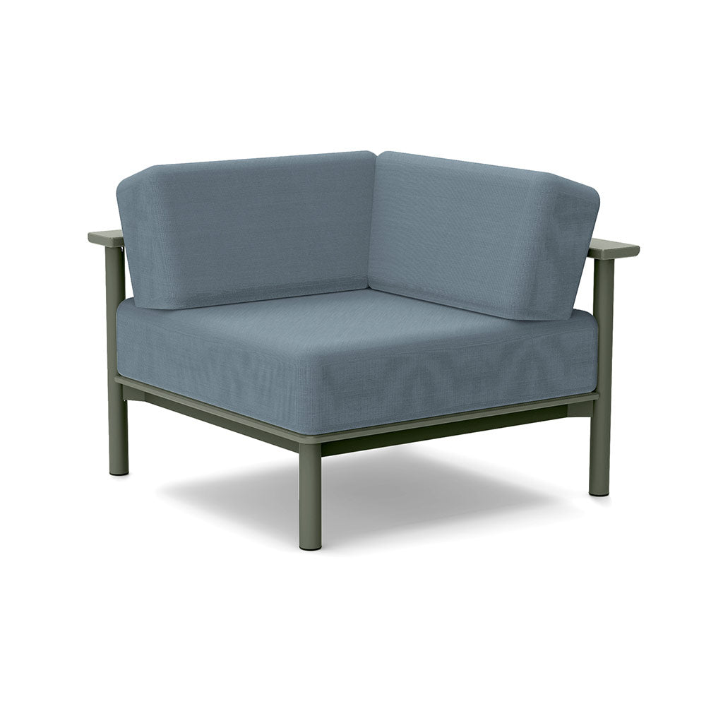 Studio image of a Corner Lounge Chair with Sage frame and Haze cushions.