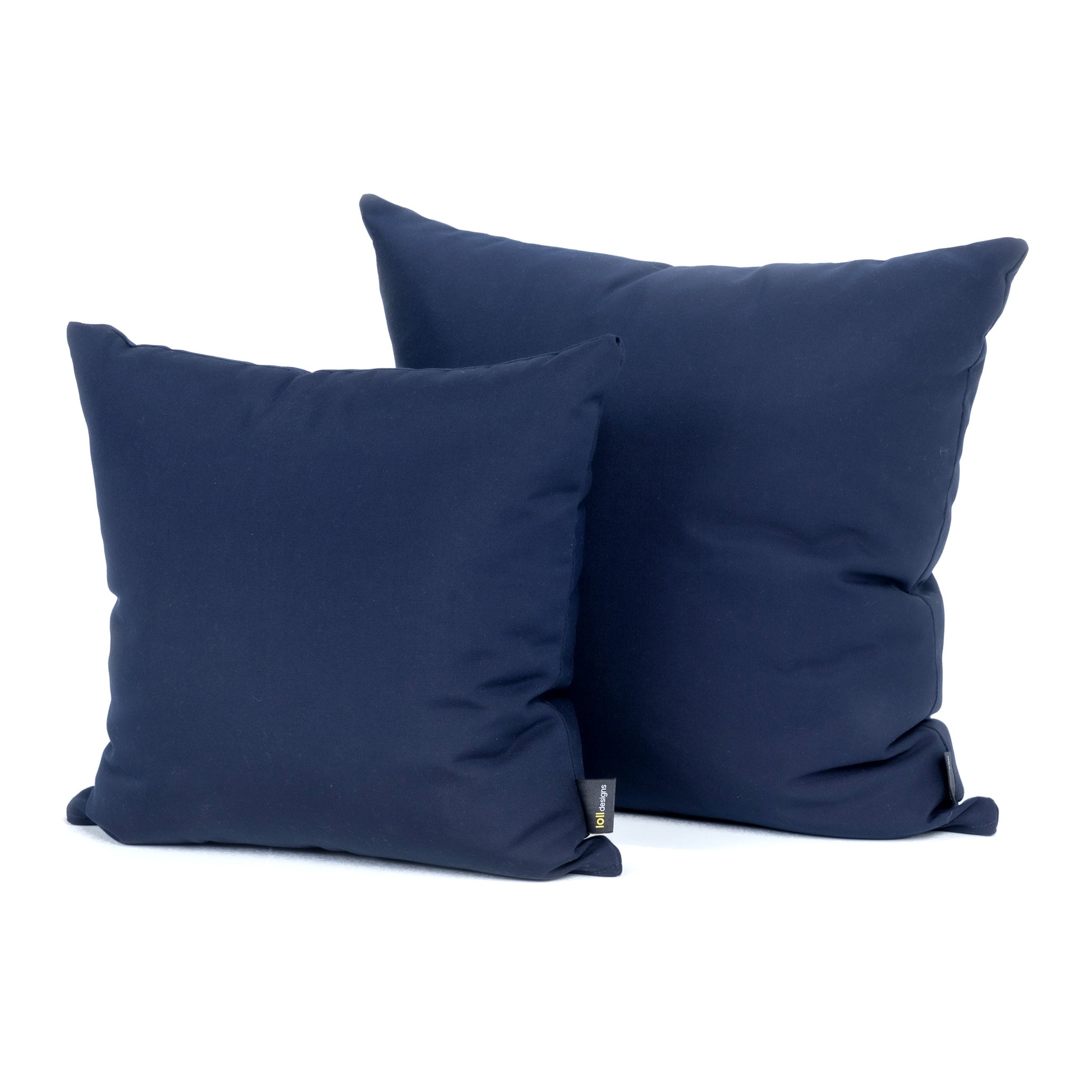 studio image of small and large square cushion in navy